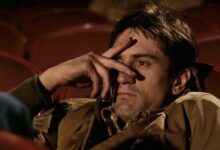 robert deniro as travis bickle with fingers over his eyes in a scene from taxi driver