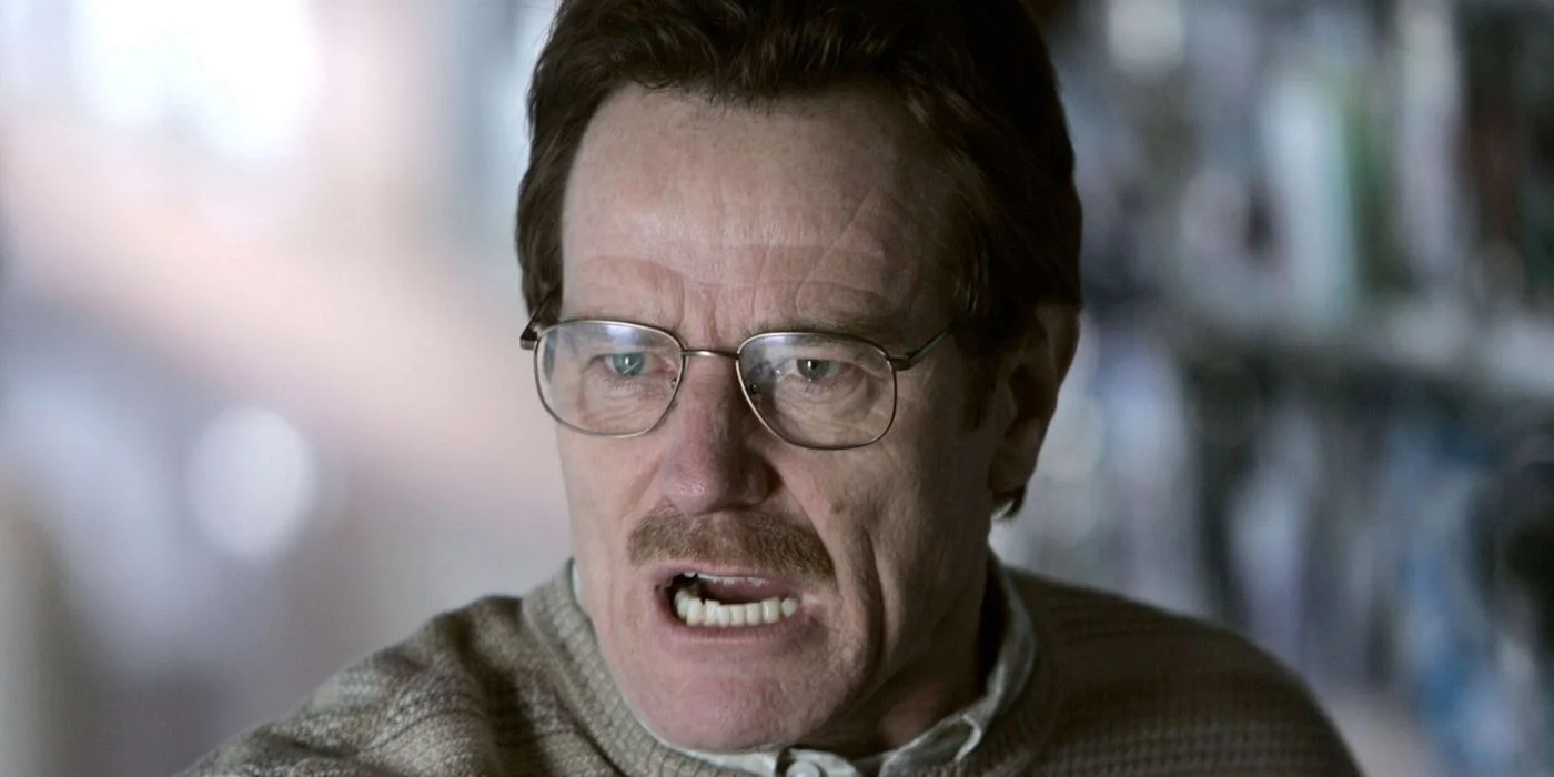 bryan cranston as walter white with dark hair and a sweater