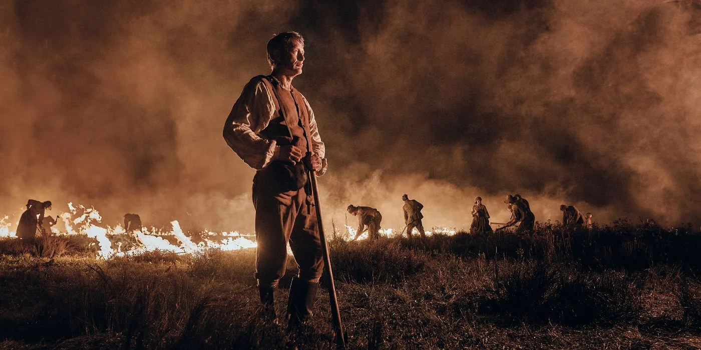 mads mikkelsen as the captain standing in the burning jutland in the promised land