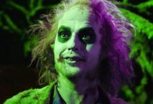 michael keaton as beetlejuice with a green hue